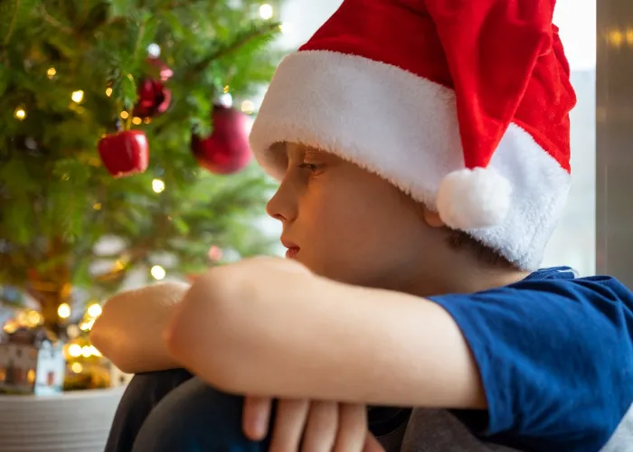 Sad boy at home waiting for Christmas